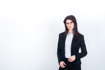 Slim woman with glasses and a strict suit