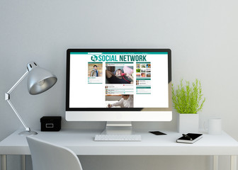 modern clean workspace with social network website on screen