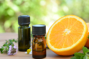 essential oils with orange and herbs