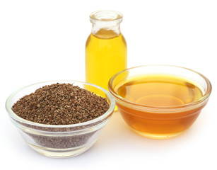 Ajwain seeds in a glass bowl with essential oil