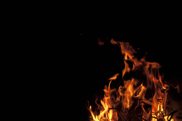 Fire flame on a black background. Texture of a flame