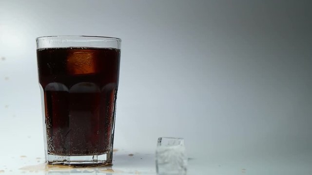 Ice in a glass with cola