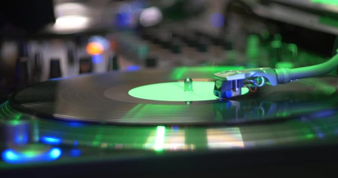 DJ Works With Turntables And Vinyl Disc.