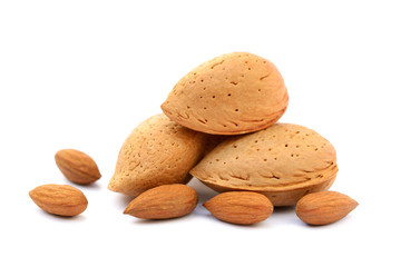 Heap of fresh almonds in shells isolated on white background