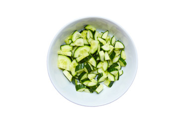 the cut cucumbers in a plate on a white background