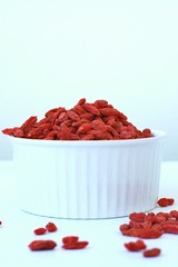 Chinese goji in the bowl on the white background