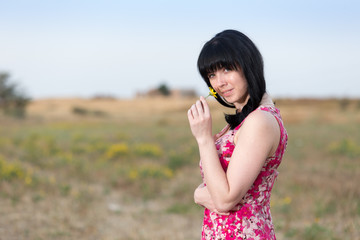 Portrait of a young girl girl in a field