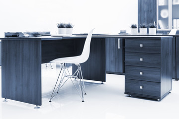 desk, plastic chair and bookcase