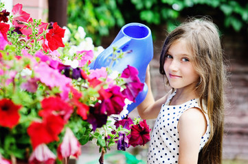 kid girl watering flowers