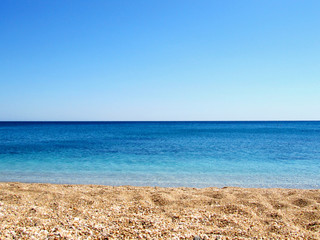 The blue sea on the Plathiena Beach in Milos island, Greece. Suitable to be use like a background.