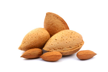 Heap of fresh almonds in shells isolated on white background