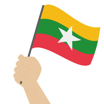 recommend clip art: Hand holding and raising the national flag of Myanmar