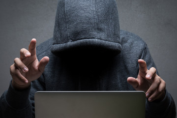 hacker with computer notebook