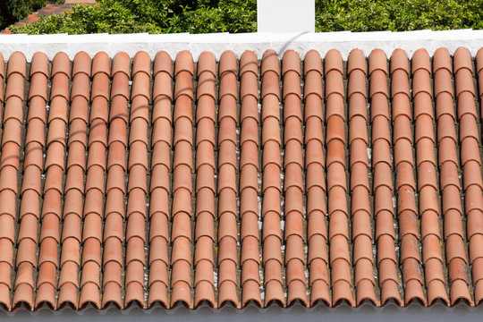 Background ornament terracotta red tiles on roof in the Mediterranean 