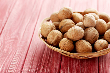 Walnuts on a red wooden table