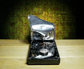  broken the hard drive from the computer in the background of th