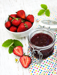 Strawberry jam and fresh strawberries