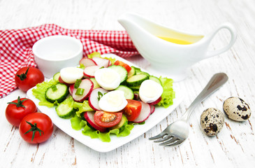 Spring salad with eggs, cucumbers and radish