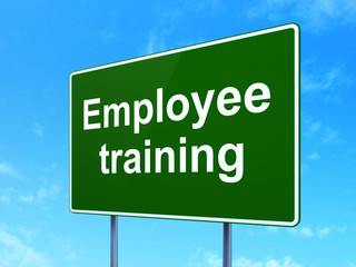 Studying concept: Employee Training on road sign background