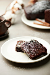 Tasty chocolate cake and cotton flowers