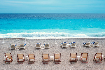 Chairs and tables on Nice beach along Promenade des Anglais