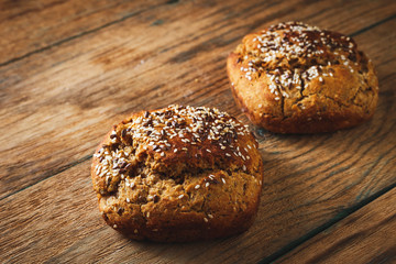 Freshly baked homemade bread on rustic wood background