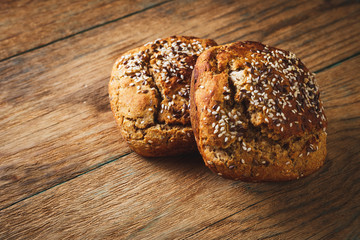 Freshly baked homemade bread on rustic wood background
