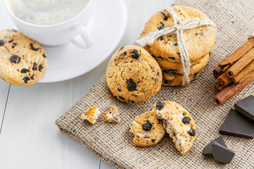 Fresh baked chip cookies for dessert. Delicious biscuits with coffee. Top view.