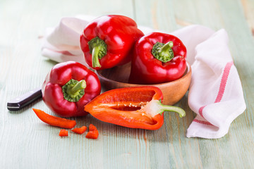 Fresh organic bell peppers on a wooden board