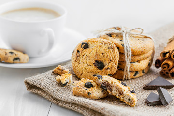 Cookies with chocolate on a table for dessert. Fresh biscuits with coffee for breakfast.