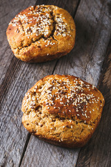 Freshly baked homemade bread on rustic wood background