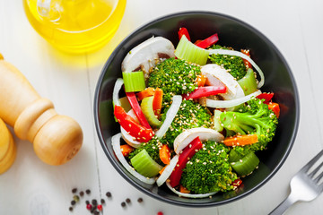 Salad in a bowl made of vegetables.  Healthy vegetarian food. Top view, close-up.