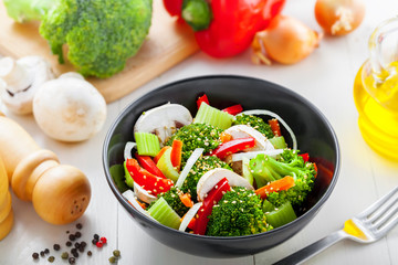Healthy food made of broccoli, onion, mushroom, carrot and pepper. Vegetarian salad.