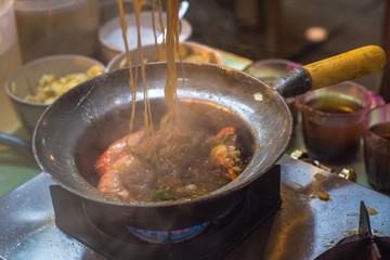 Cooking of glass noodles with shrimps, authentic Thai cuisine © javarman