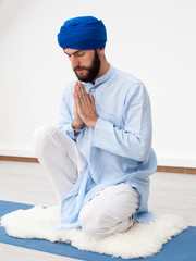 Meditation. Portrait of a young bearded man in a turban