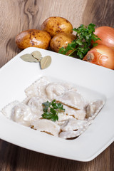 Dumplings with potatoes garnished with Sour Cream, Butter