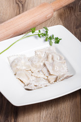 Dumplings with potatoes garnished with Sour Cream, Butter