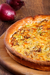 Pizza with beef stuffing, leek and cheese