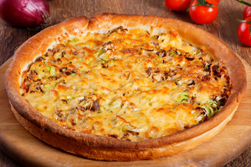 Pizza with beef stuffing, leek and cheese