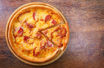 Pizza with salami, pastrami, ham and cheese