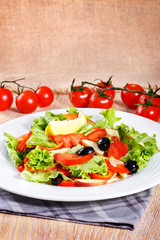 Fresh vegetable salad on the wooden table