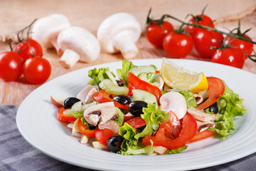 Fresh vegetable salad on the wooden table