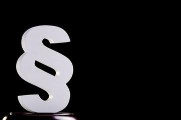 White wooden paragraph - law symbol on black