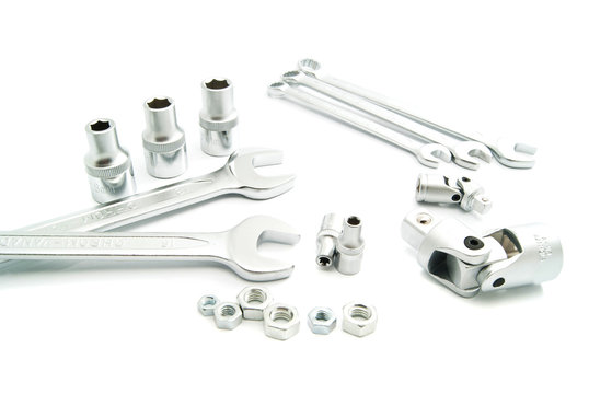 wrenches and metal heads on white
