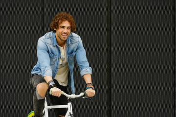 Handsome young man with fixed gear bicycle.
