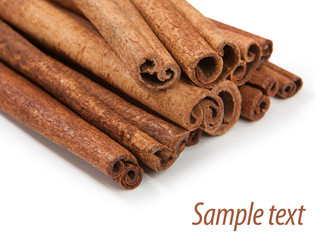 Cinnamon isolated on white background. Sample text