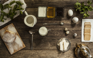 mint, bread,  milk on a wooden table