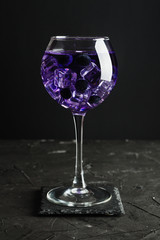 Cold blueberry drink with ice