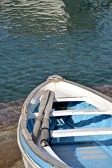 Small wooden row boat on the shore