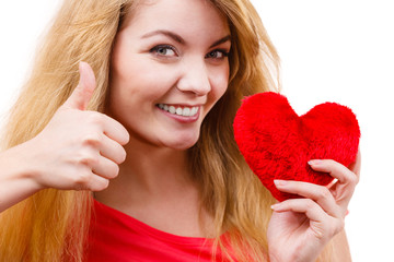 Woman blonde girl holding red heart love symbol